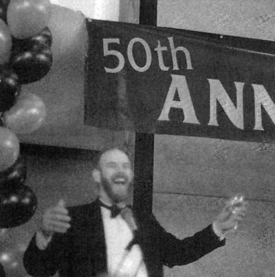 Convention co-chairman Mike Stewart
leads a toast